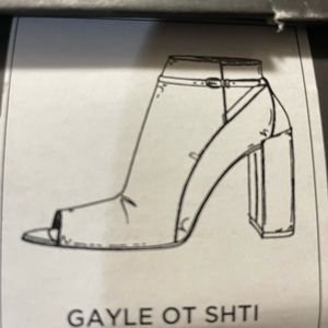 Black leather shoes with open toe.